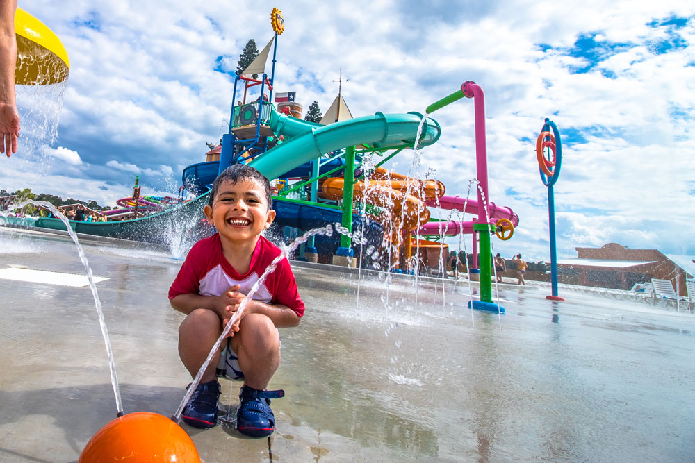 Boy Smiling At Polliwog Puddle